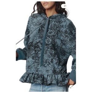 Pilcro Drop-Shoulder Flounce Hoodie in a blue and black floral patter